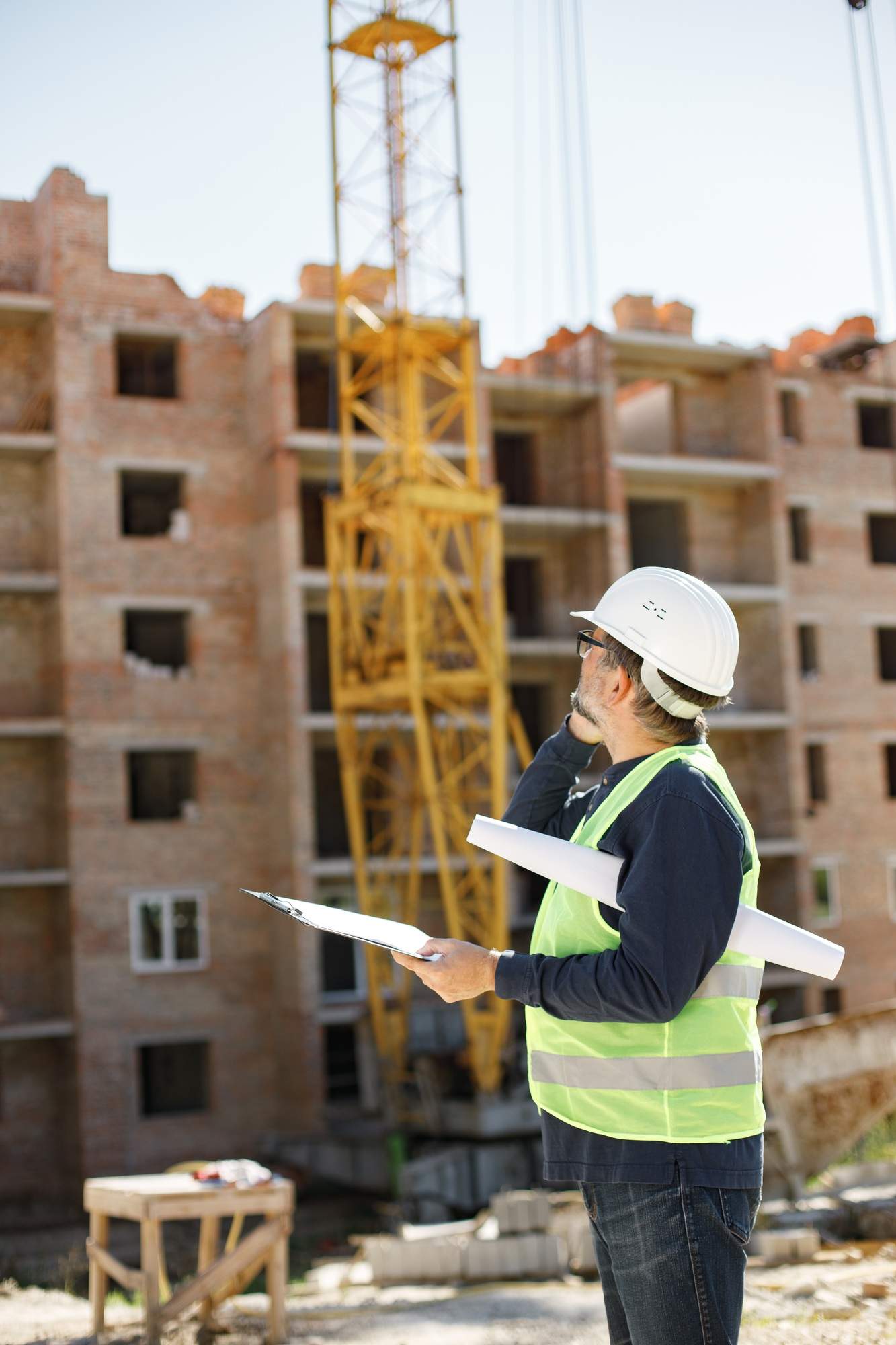 Seo for construction 1 seo, web design & marketing agency town press media Architect with papers at a construction site talking on the phone
