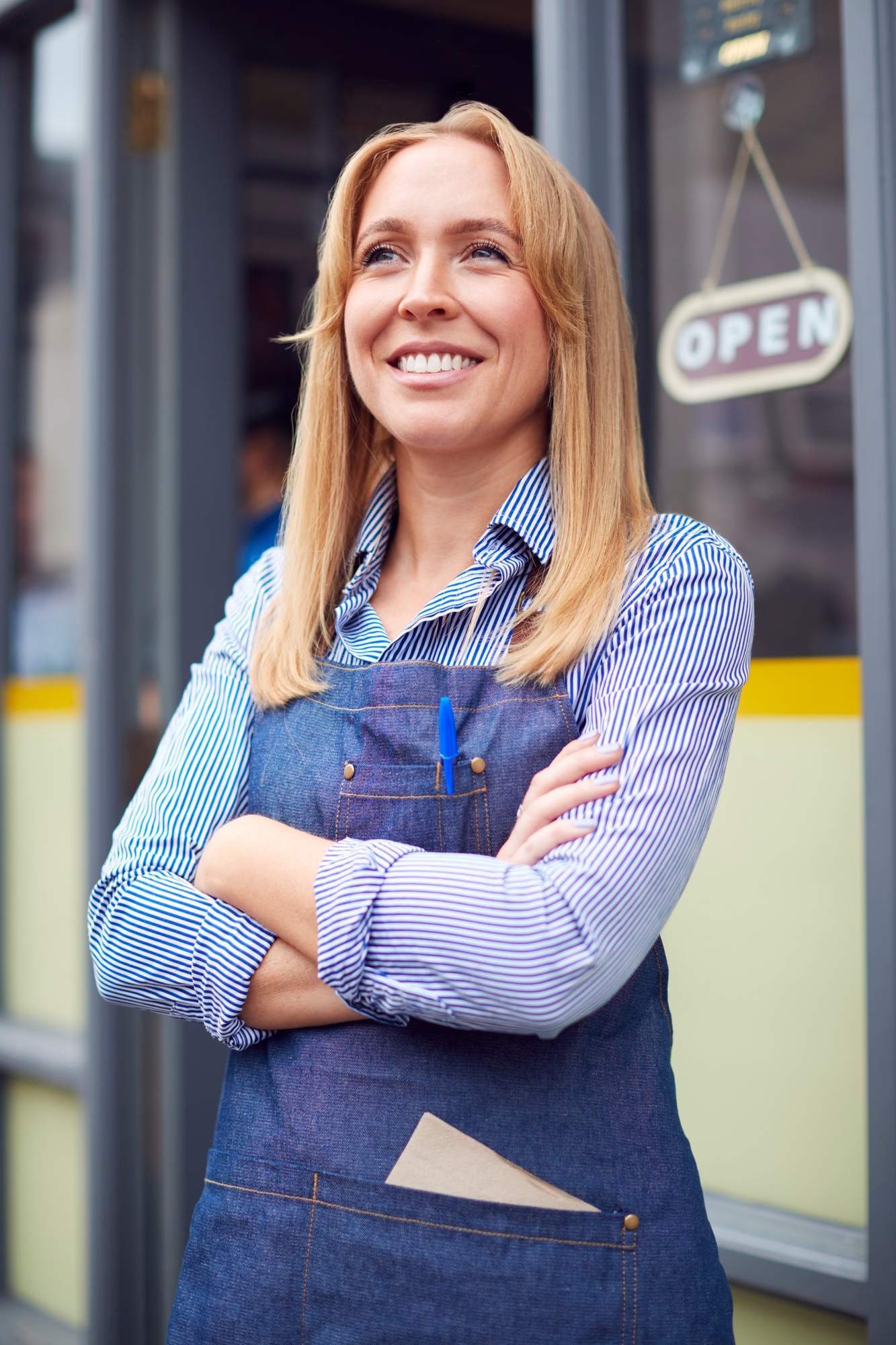 Local website maintenance company 1 seo, web design & marketing agency town press media Portrait of female owner or staff standing outside coffee shop