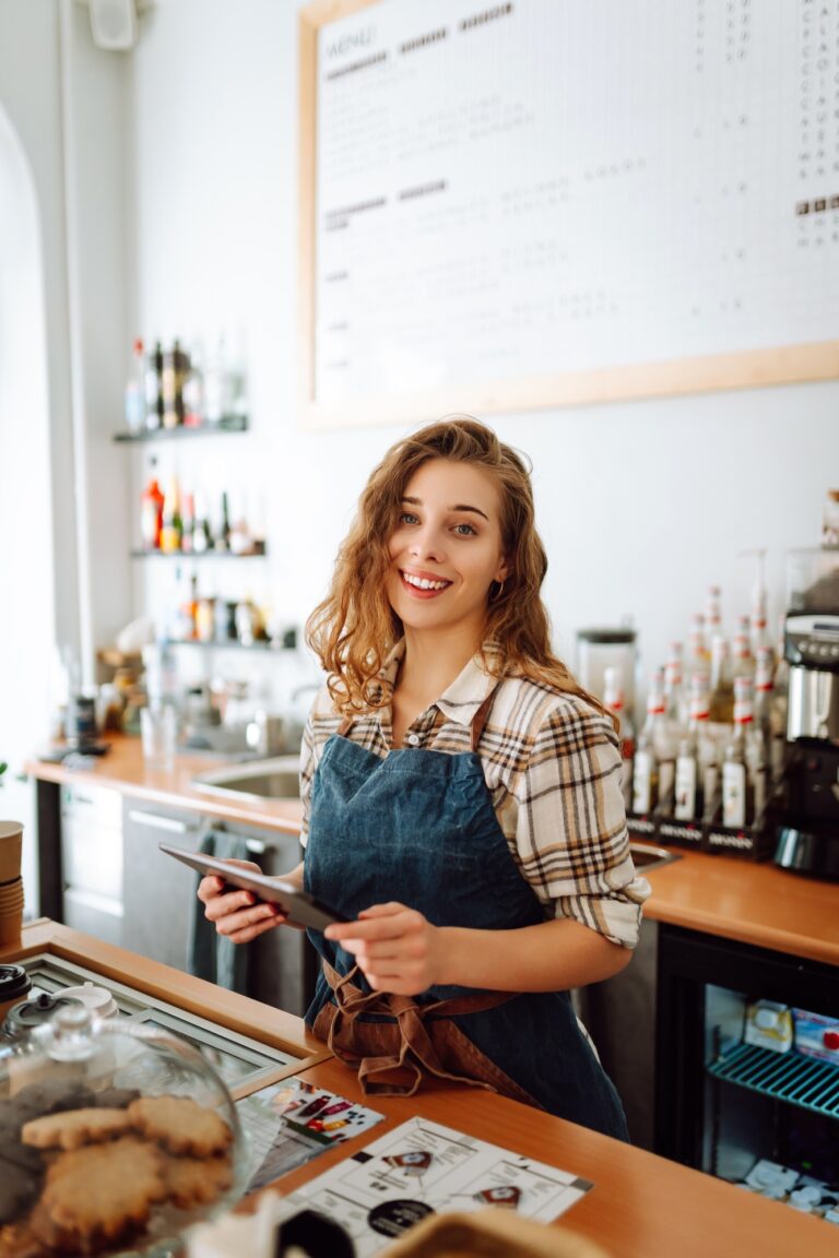 Town press media 7 seo, web design & marketing agency town press media Successful small business owner stands behind counter of coffee shop with digital tablet takes order