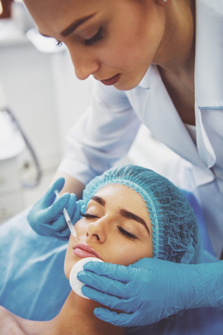 A woman getting an injection on her face