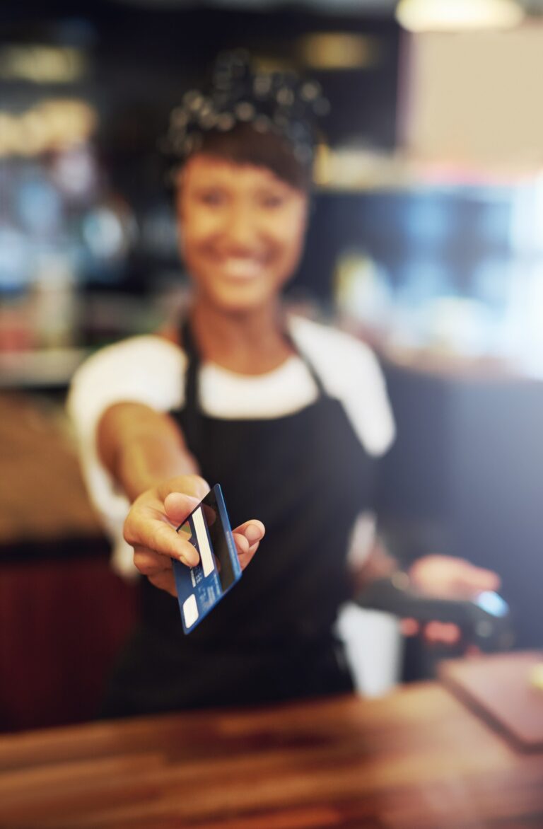 Town press media 10 seo, web design & marketing agency town press media Young small business owner handing back a card